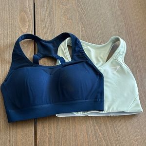 Two Women’s XS GymShark Sports Bras. Navy Blue and Light Green.